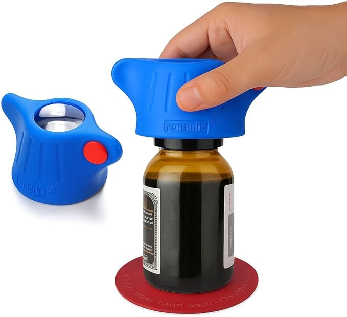 Remedic One-Hand Pill Bottle Opener – Magnifier & LED Light Aid | Non-slip mat secures bottles for one-hand opening. Magnifier and LED light help read medication labels.