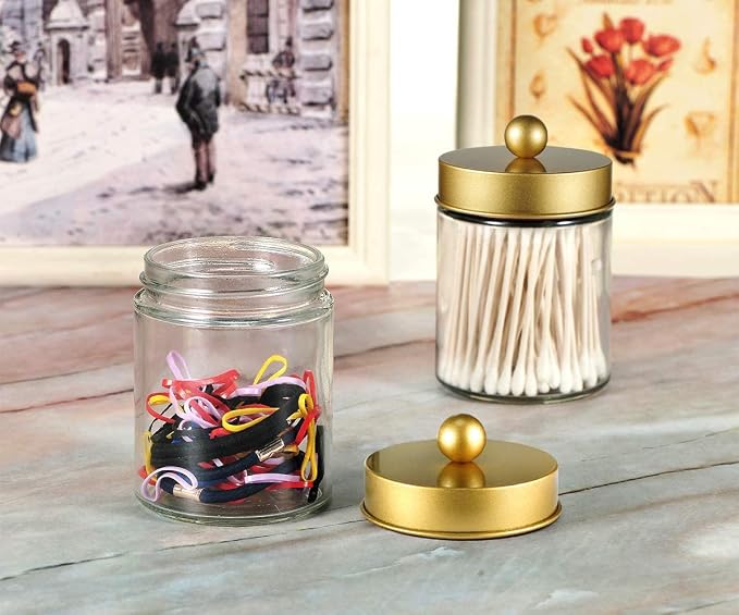 Amolliar 4 Pc Glass Apothecary Jars - Countertop Qtip Dispenser Holder with Stainless Steel Lids &Cute Stickers -Bathroom Vanity Storage Organizer Set for Qtips,Cotton Swabs,Makeup Sponges(Gold)
