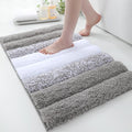 XIYUNTE Shaggy Bathroom Rugs 32x20, Extra Thick 2000GSM Non Slip Bath Mat with Drain Groove Rubber Backing, Washable Quick Dry Absorbent Microfiber Bath Rugs for Bathroom Floor Tub Shower, Gray White
